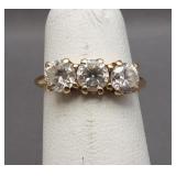 10K Yellow gold ring featuring CZ stones. Size 6.