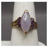 14K Yellow gold ring featuring purple stones.