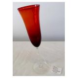 Royal ruby glass Champaign flute. Measures 9.5"