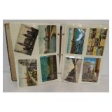 (166) Vintage postcards in an album.