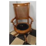 Oak rolling office chair with padded seat and