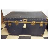 Vintage storage trunk with metal trim and insert.