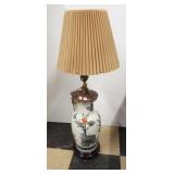 Ceramic floral design electric lamp with shade.