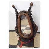 Vintage horse collar wall mirror. Measures 26"