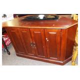 Cherry wood corner entertainment cabinet.