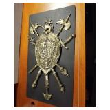 Large brass shield wall hanging. Measures 32" x