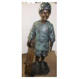 Bronze skating boy statue. Measures 53" tall.