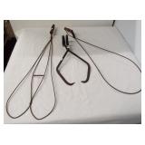 (2) Vintage rug beaters and vintage ice tongs.