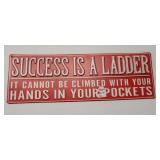 Metal Success is a ladder sign. Measures 5.5" x