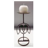 Metal dog design candle holder and candle.