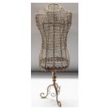Metal decorative dress form with leaf design.