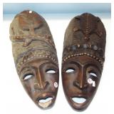 Decorative tribal hand carved wood wall masks.