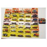 (31) New in package Matchbox cars.