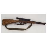 Toy wood handled gun. Measures 26" long.