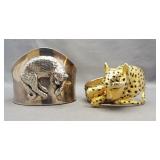 (2) Cuff bracelets featuring cheetah designs. One