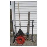 Leaf rake, post hole digger, power cord and