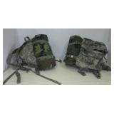 (2) Military backpacks with sleeping bags.