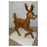 Decorative wood reindeer display. Measures: 35"