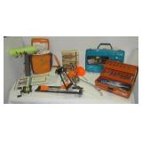 Assortment of fishing items that includes tackle,