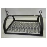 Hanging metal camping over the fire cooking rack.