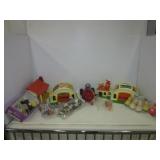 Assortment of vintage plastic kids toys including
