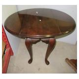 Vintage wood small drop leaf table. Measures: 24"