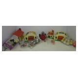 Assortment of vintage plastic kids toys including