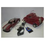 (2) RC cars. Note: Unknown working condition.
