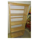 Four tier wood shelving unit. Measures: 63" h x