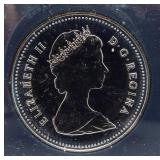 1983 Brilliant Canadian 50% silver dollar.