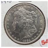 1884-O Morgan silver dollar.