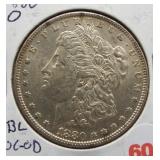 1880-O Morgan silver dollar. Dbl in "God we