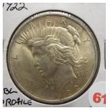 1922 Peace silver dollar. Dbl profile, "22" and