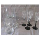 (4) Glass mugs and (4) Champaign flutes.