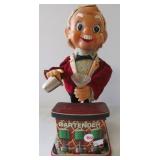 Vintage tin mechanical bartender. Measures 11"