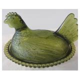 Green glass hen on the nest. Measures 7" long.