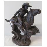 Resin cowboy on horse statue. Measures 11" x 11".
