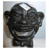 Black American bottle opener. Measures 4" tall.