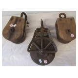 (3) Vintage wood barn pulleys.
