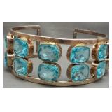 Sterling silver cuff bracelet featuring 16 blue