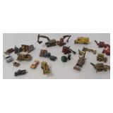 Miniature metal cars, trucks and farm machinery.
