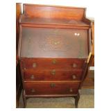 Antique secretary desk with three drawers.