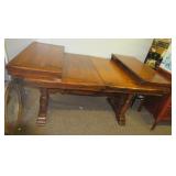 Vintage wood dining table with two leaves.