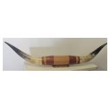 Mounted bull horns. Measure 66" long.