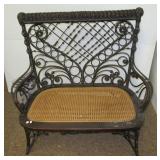 Haywood Wakefield wicker bench with cane seat.