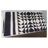 Vintage hand made flying geese quilt.