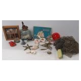 Vintage fishing items including red glass bobber,