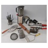 Vintage kitchen items including sifter, utensils,