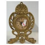 Antique metal wind up shelf/mantle clock. Works.