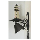 Cast metal lighthouse design flange bell.